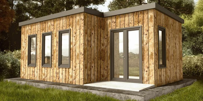 Casa minimalista pequeña construida en medio del campo, construida en medio del espacio de pastoreo de ovejas