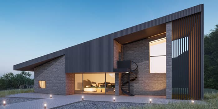 Muro exterior de una casa minimalista pequeña elaborado con mampostería de piedra