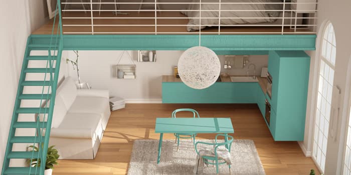 Vivienda con entrepiso de madera y acero construido dentro del espacio principal